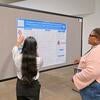 Shubi discussing poster