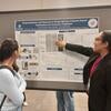 Andrea discussing poster